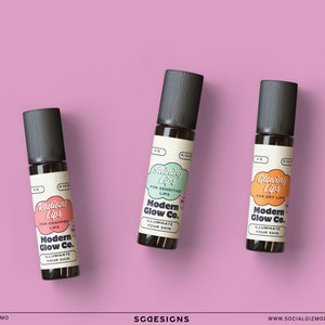 May include: Three small glass bottles with black caps and labels. The labels are white with black text and colourful illustrations. The labels read "Radiant Lips for Chapped Lips", "Shining Lips for Sensitive Lips", and "Glowing Lips for Dry Lips". All three bottles have the text "Modern Glow Co. Illuminate Your Skin".