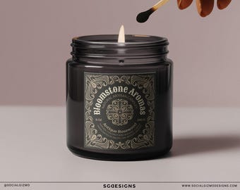 May include: A black glass candle jar with a gold label that reads "Bloomstone Aromas Natural Artisan Candles 8 oz Antique Rosewood Hand-poured Soy Wax Scented with Essential Oils"