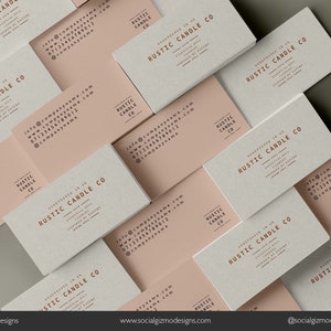 May include: A close-up of a stack of business cards with a rustic design. The cards are beige and white with the text "RUSTIC CANDLE CO" printed in brown. The text "Handpoured in the UK" is also printed on the cards.