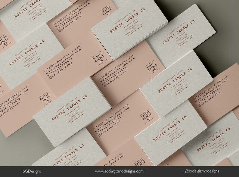 May include: A close-up of a stack of business cards with a rustic design. The cards are beige and white with the text "RUSTIC CANDLE CO" printed in brown. The text "Handpoured in the UK" is also printed on the cards.