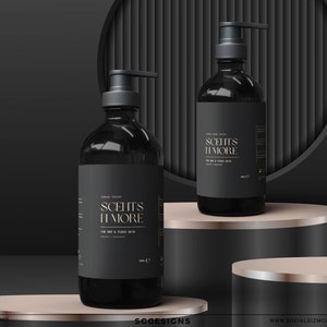 May include: Two black bottles of luxury lotion with gold lettering that reads "Scent's More" on a black and gold platform. The bottles have pumps and are on a black and gold platform.