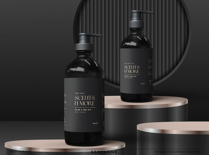 May include: Two black bottles of luxury lotion with gold lettering that reads "Scent's More" on a black and gold platform. The bottles have pumps and are on a black and gold platform.