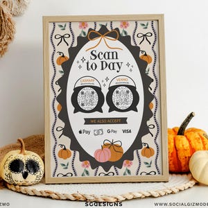 May include: A rectangular wooden frame containing a sign with the text Scan to Pay, CashApp, Venmo, and We Also Accept. The sign features two black cauldron graphics with QR codes, orange pumpkin illustrations, and payment icons for Apple Pay, G Pay, and Visa.