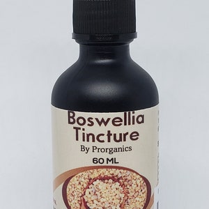 May include: A dark brown glass bottle with a black dropper top. The bottle is labeled "Boswellia Tincture" with the text "By Prorganics" and "60 ML". The label also includes the text "Non-Gmo's Ingredients", "Concentrated Formula", and "Made in Puerto Rico".