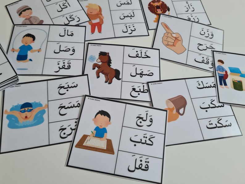 May include: A collection of flashcards with Arabic words and illustrations. Each card features a word in Arabic script alongside a corresponding image, such as a child jumping rope or a horse. The cards are designed for educational purposes.