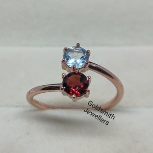 Garnet and outlet aquamarine ring