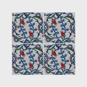 May include: Four square ceramic tiles with a floral design. The tiles feature a white background with a pattern of red tulips, blue flowers, and green leaves. The design is symmetrical and detailed.