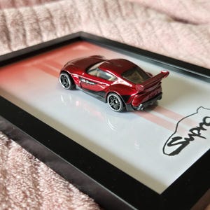 Framed Toyota Supra – Classic JDM Die-Cast Car Wall Art for Car Enthusiasts
