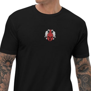 May include: Black t-shirt with a red and white graphic of a helmet with wings.