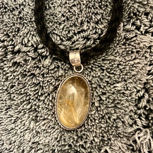 Golden Rutilated Quartz Pendant set in decorated Bali style Sterling Silver Woven Black Cord | Button Closure Black necklace | Crown Chakra