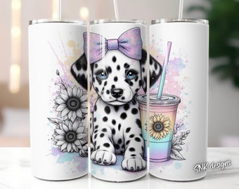 May include: A white tumbler with a colorful watercolor background featuring a dalmatian puppy wearing a pink bow. The puppy is sitting with its paws crossed and looking at the viewer. The tumbler has a black and white sunflower design on the side. The tumbler is 20 ounces.