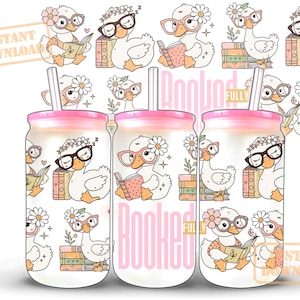 May include: Three glass tumblers with pink lids and straws, decorated with a repeating pattern of cartoon ducks wearing glasses and reading books. The words "Booked Fully" are printed on the tumblers.