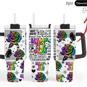 May include: A white travel mug with a black handle and lid, decorated with a vibrant rose design and the words "MAMA IT'S OKAY." The design includes butterflies, hearts, and stars. A straw is inserted in the lid.