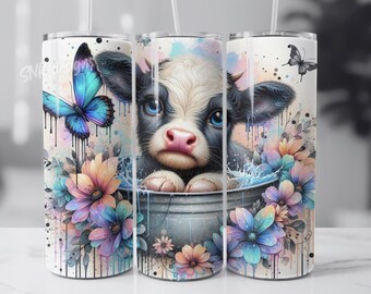 May include: A stainless steel tumbler with a colorful design featuring a black and white calf with blue eyes, a butterfly, and watercolor flowers.
