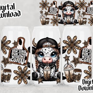 May include: White beverage can featuring a cartoon cow wearing a black cap and holding a coffee drink. The can has the text "BAD VIBES DON'T GO WITH MY COFFEE" and decorative elements like stars and flowers.