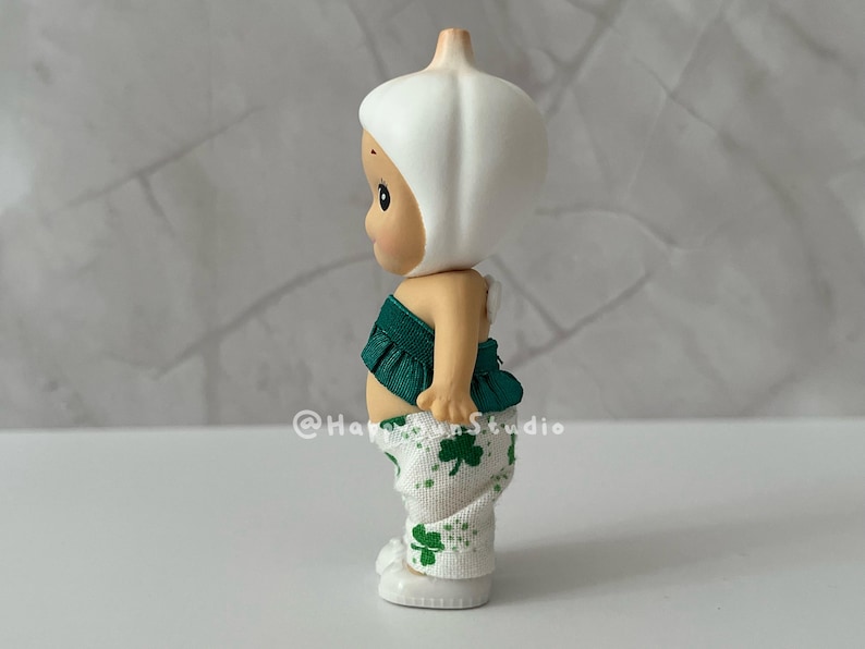 May include: A set of three ceramic mugs with a speckled, matte finish. The mugs are in shades of cream, light gray, and dark gray. Each mug has a simple, modern design and a rounded handle. The mugs are stacked on top of each other.