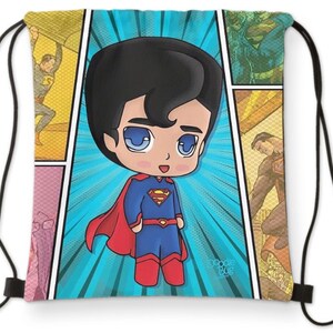 May include: A blue drawstring bag with a comic book design featuring a cartoon Superman. The bag has a red cape and yellow S symbol. The text "Doodle Bug" is in the bottom right corner.