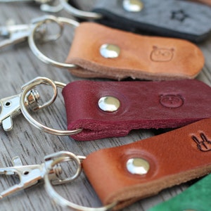 Personalized key ring (gold/silver) with desired text and some symbols as selected from the example photo (max. 8 characters)