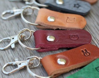 Personalized key ring (gold/silver) with desired text and some symbols as selected from the example photo (max. 8 characters)