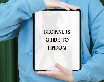 May include: A person holding a tablet with a white background and black text that reads "BEGINNERS GUIDE TO FINDOM".