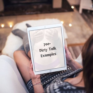 May include: A white tablet computer with a screen displaying the text "700+ Dirty Talk Examples".
