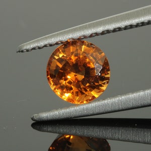 0.52 (ct) round spessartine garnet