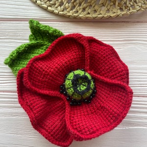Knitted poppy flower