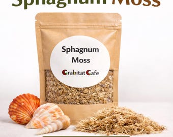 May include: A kraft paper bag of Sphagnum Moss with a white label and the text "Sphagnum Moss" and "Crabitat Cafe". A pile of moss and two seashells are in front of the bag. The text "Hermit Crab Safe" is at the bottom.