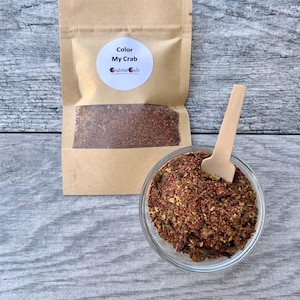 May include: A set of three ceramic mugs with a speckled, matte finish. The mugs are in shades of cream, light gray, and dark gray. Each mug has a simple, minimalist design, perfect for coffee or tea.