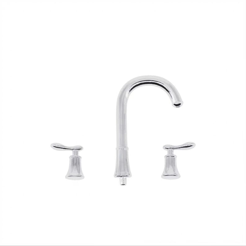May include: A chrome bathroom faucet with two handles and a high arc spout.