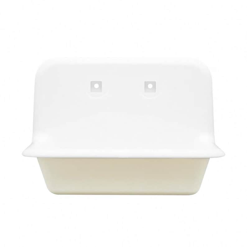 May include: A white, rectangular wall-mounted sink with a rounded top and a slightly off-white basin. The sink has two square mounting holes near the top. The design is simple and modern, suitable for a bathroom or utility space.