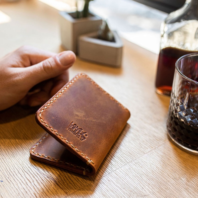 Minimalist design bi-fold wallet.