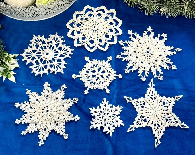 Festive winter decor: white snowflakes Handmade in a set of 7 snowflakes crocheted from high-quality white cotton yarn.