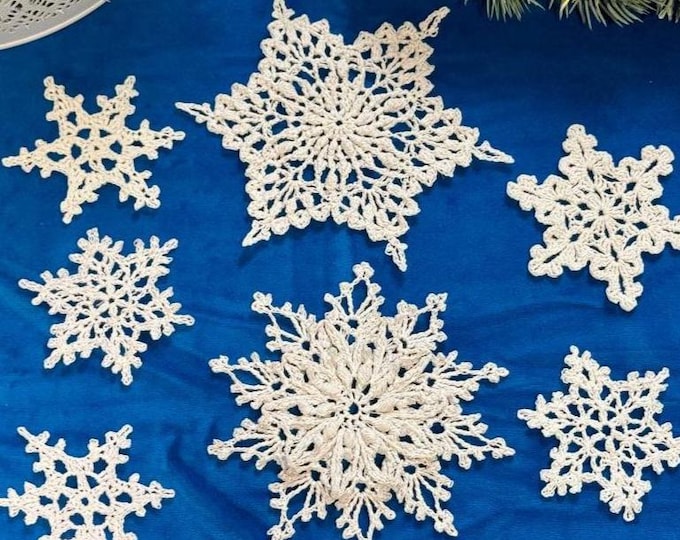Christmas Ornaments: White Snowflakes Handmade set of 7 snowflakes crocheted from quality white cotton yarn.