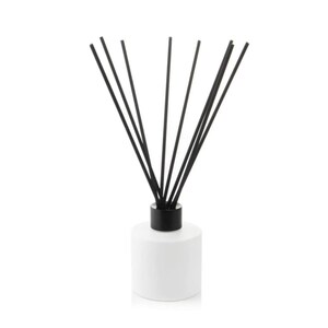 May include: A white ceramic diffuser bottle with a black lid and black diffuser sticks.