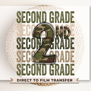 May include: A green, brown, and white camouflage design with the number "2" in the center and the text "SECOND GRADE" repeated four times. The text "DIRECT TO FILM TRANSFER" is at the bottom of the image.
