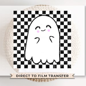 May include: A white ghost with a black checkered background. The ghost has a smiling face with pink cheeks and is holding its hands up in a gesture of greeting. The text "DIRECT TO FILM TRANSFER" is at the bottom of the image.