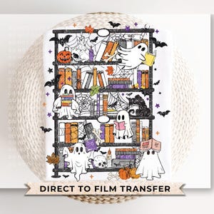 May include: A white graphic featuring a bookshelf with Halloween-themed elements. Ghosts, pumpkins, bats, and spiderwebs are scattered around the books. The text "DIRECT TO FILM TRANSFER" is at the bottom.