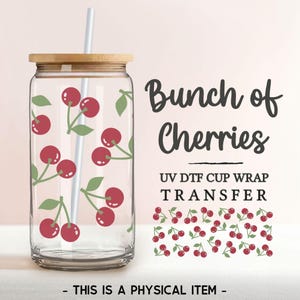 May include: A clear glass tumbler with a bamboo lid and a straw, featuring a repeating pattern of red cherries with green leaves. The text "Bunch of Cherries" and "UV DTF Cup Wrap Transfer" is printed below the image.