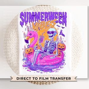 May include: White graphic tee featuring a skeleton in sunglasses, lounging on a pink flamingo floatie, holding a drink. The design includes pumpkins, bats, and the text "SUMMERWEEN VIBES" in purple and orange. A Direct to Film Transfer.