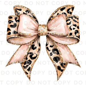 May include: A large pink bow with a leopard print pattern and gold glitter accents. The bow is tied with a knot in the center and has a white background.