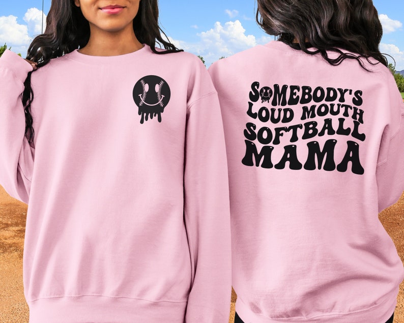 A direct to film transfer that says Somebody's Loud mouth Softball Mom. Back and front option. Front design is of baseball smiley face. The DTF transfer is a cold peel ready to press transfer.