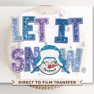 May include: A white t-shirt with a glittery blue and purple design that says "Let it Snow" with a snowman graphic.