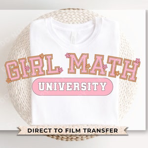 May include: White t-shirt with a pink and orange graphic that says "Girl Math University" with pink flowers around the text. Direct to film transfer.