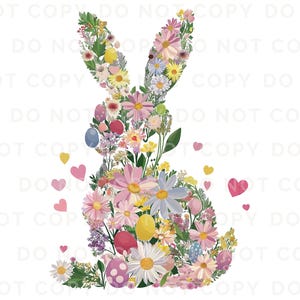 Op de afbeelding: Een roze en witte bloemstuk in de vorm van een konijn. De bloemen zijn in een speels ontwerp gerangschikt met pastelkleuren en groene bladeren.