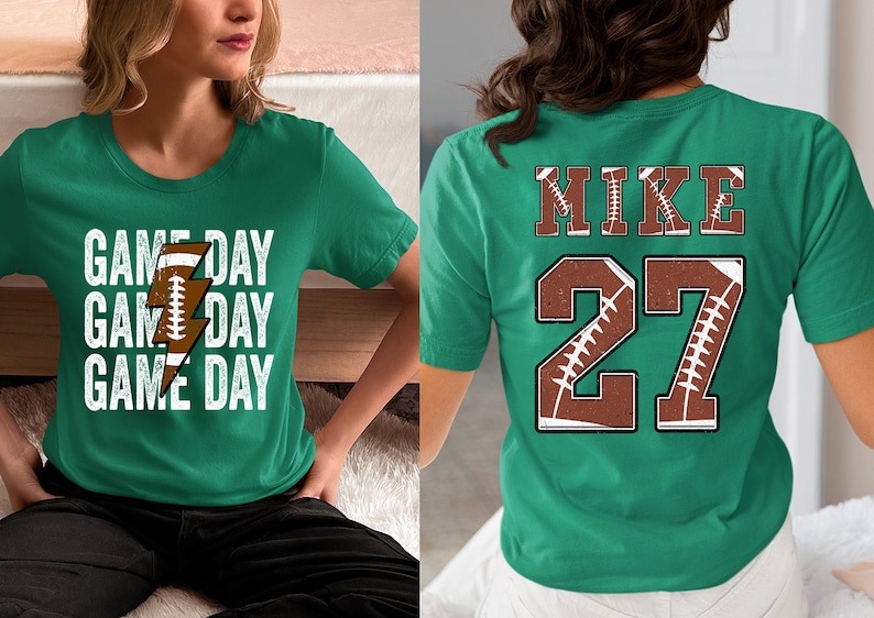 May include: Two green t-shirts with a football theme. One shirt says "Game Day" three times with a football and lightning bolt graphic. The other shirt has the name "Mike" and the number "27" with a football graphic.