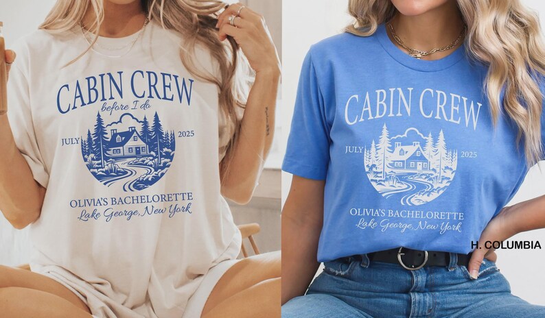 May include: Two short-sleeve t-shirts, one cream with blue text and one blue with white text. Both feature a circular graphic of a cabin in the woods with the text CABIN CREW, before I do, JULY 2025, OLIVIA'S BACHELORETTE, and Lake George, New York.