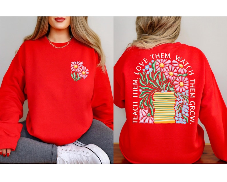 May include: A red sweatshirt with a floral design on the front and back. The front features two embroidered daisies. The back has a floral arrangement with the text "Teach Them, Love Them, Watch Them Grow."