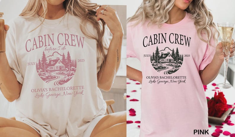 May include: Two short-sleeve t-shirts, one cream and one light pink, each featuring a circular graphic with a cabin, pine trees, and a winding path. The text reads CABIN CREW, before I do, JULY 2025, OLIVIA'S BACHELORETTE, and Lake George, New York.