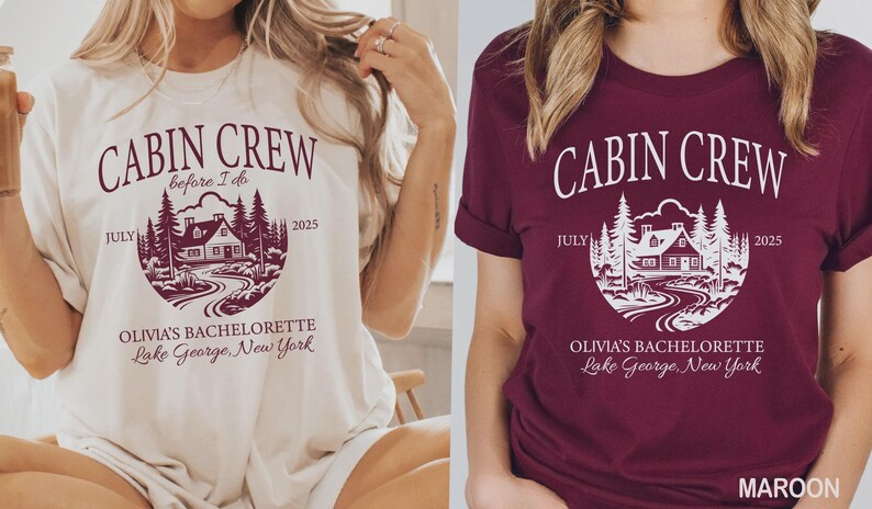 May include: A cream t-shirt and a maroon t-shirt, each featuring a graphic of a cabin in the woods with the text CABIN CREW, before I do, JULY 2025, OLIVIA'S BACHELORETTE, and Lake George, New York printed in a circular design on the front.